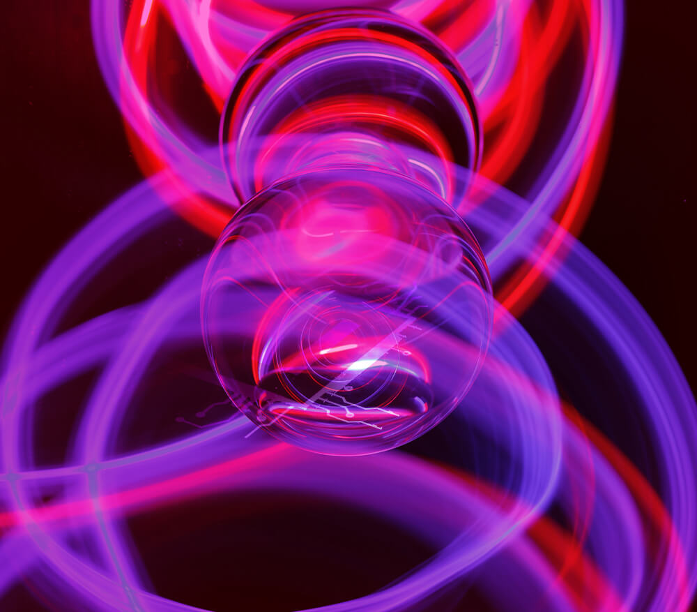 Closeup of lightbulb in a purple background